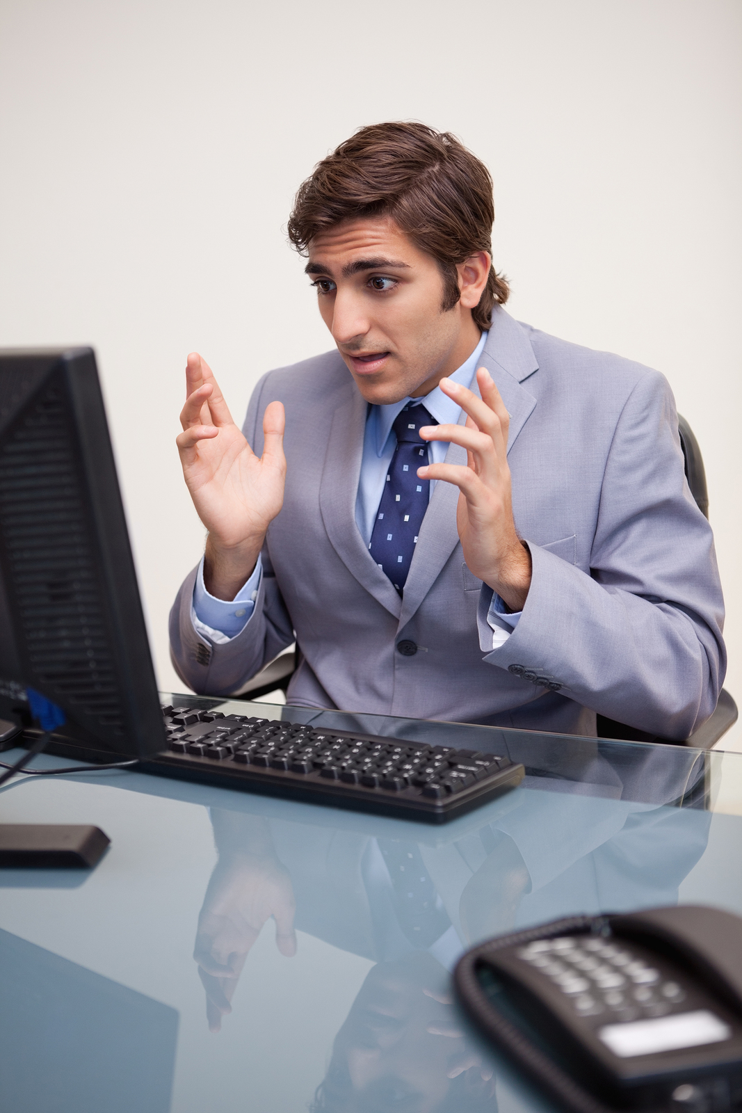 bigstock-Young-businessman-getting-surp-27297122