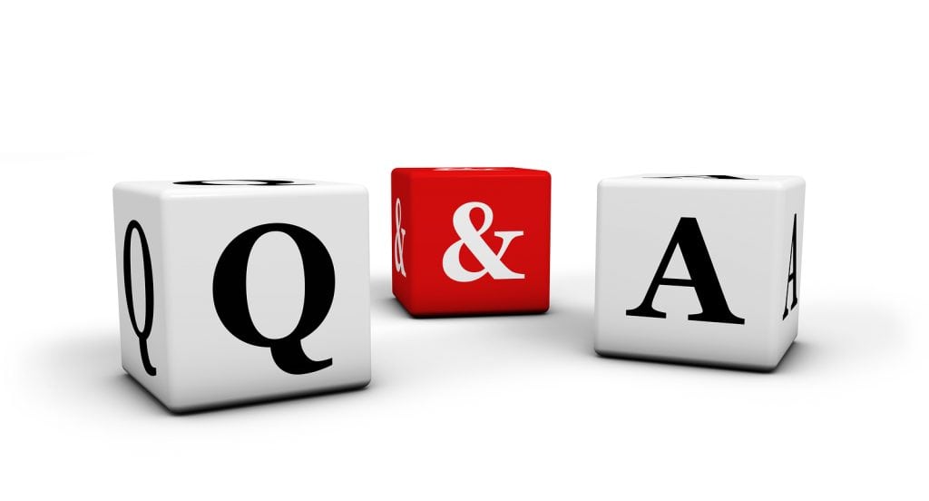 Question and answer web faq and business contact center support concept with q & a letters on white and red cubes isolated on white background.
